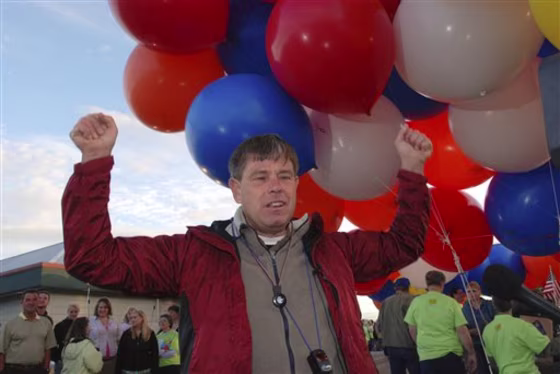 Kent Couch describes the joy of his childhood fantasy of being able to fly by grabbing clusters of helium balloons prior to taking flight, in Bend, Ore., on July 5, 2008. Couch&nbsp;now is planning another cluster balloon adventure, in Baghdad. Couch told KTVZ he was invited by Iraqi daredevil Fareed Lafta who wants to lift off with him Nov. 15 at a Talent for Youth Conference in the Green Zone. 